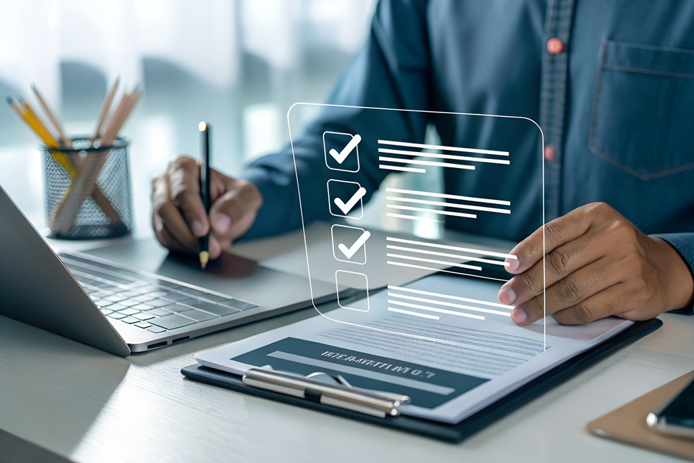 User drafting a quote on a tablet with approval icons, representing Syspro Quotations & Estimates automation.